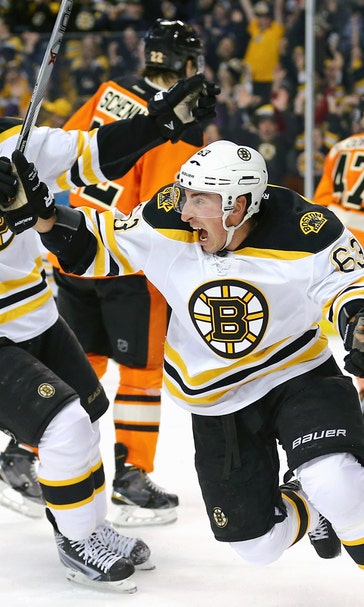Marchand scores twice, leads Bruins to OT win over Flyers